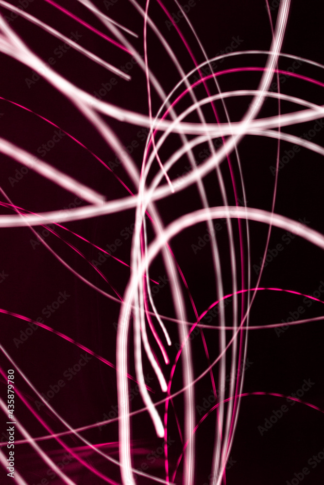 Bright light lines on dark background. the light trails on the street captured with long exposure shot Bright light lines on dark background. the light trails on the street captured with long exposure shot