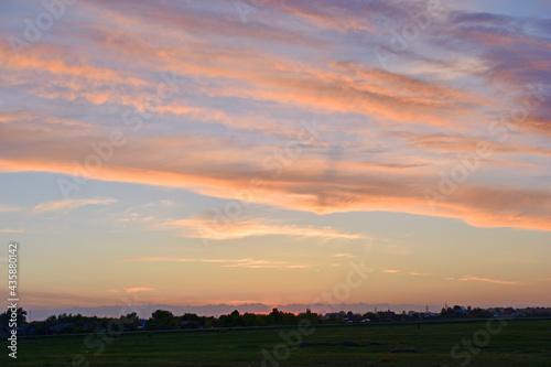 Sunset landscapes with a field in the evening