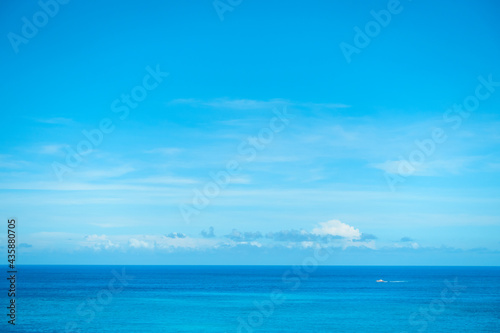 In the summer on the east coast of Hualien, Taiwan, the endless sky and sea form a gradual cool blue