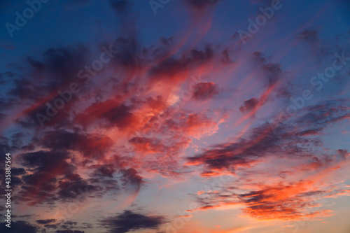 A stunning pink, orange and blue clouds at sunset sky, sunset background.