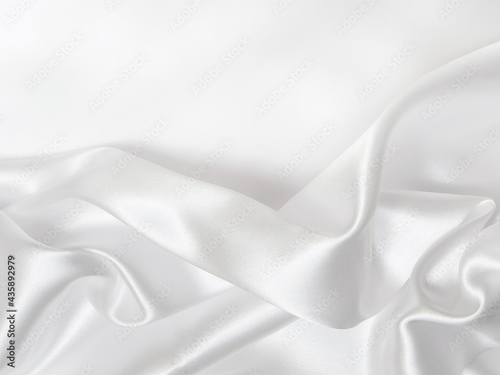 White silk folds texture. Abstract background. 