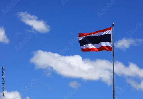 3 red blue white Thai realistic flag . Thai wavy aginst blue sky patriotic symbol