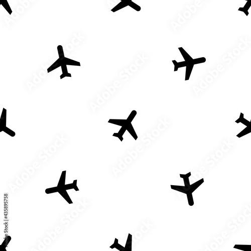 Seamless pattern of repeated black plane symbols. Elements are evenly spaced and some are rotated. Vector illustration on white background