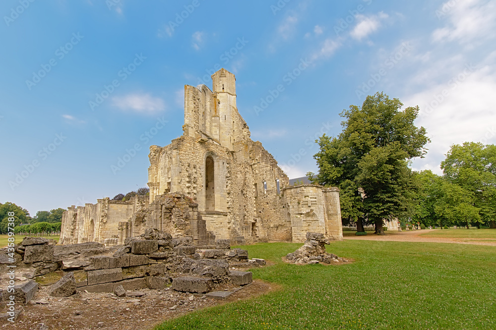 Wide angle view on the ruins of the medieval Abbey of Chaalis, Ermenonville, France, on a sunny day with clear blue sky
