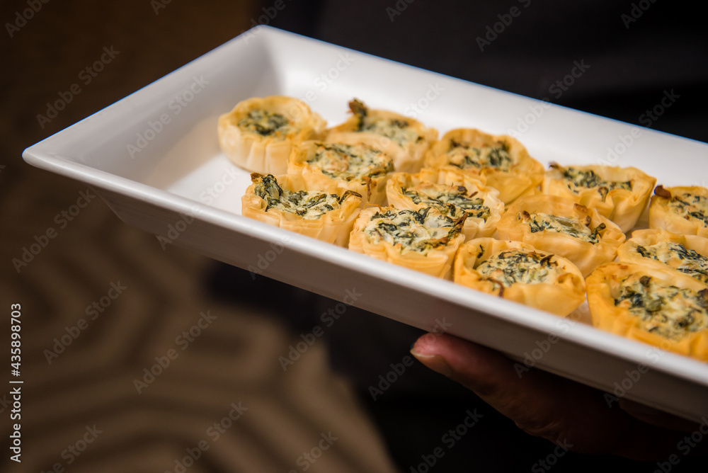 Spinach and artichoke wrap appetizer platter. Macro view