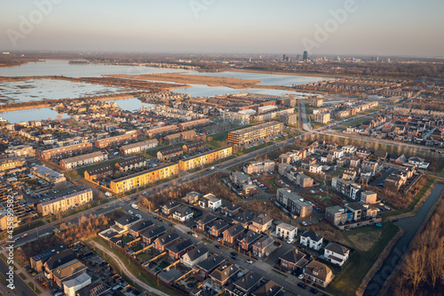 Modern residential neighborhood in Almere, Flevoland, The Netherlands, surrounded by nature. Aerial view.  © Pavlo Glazkov