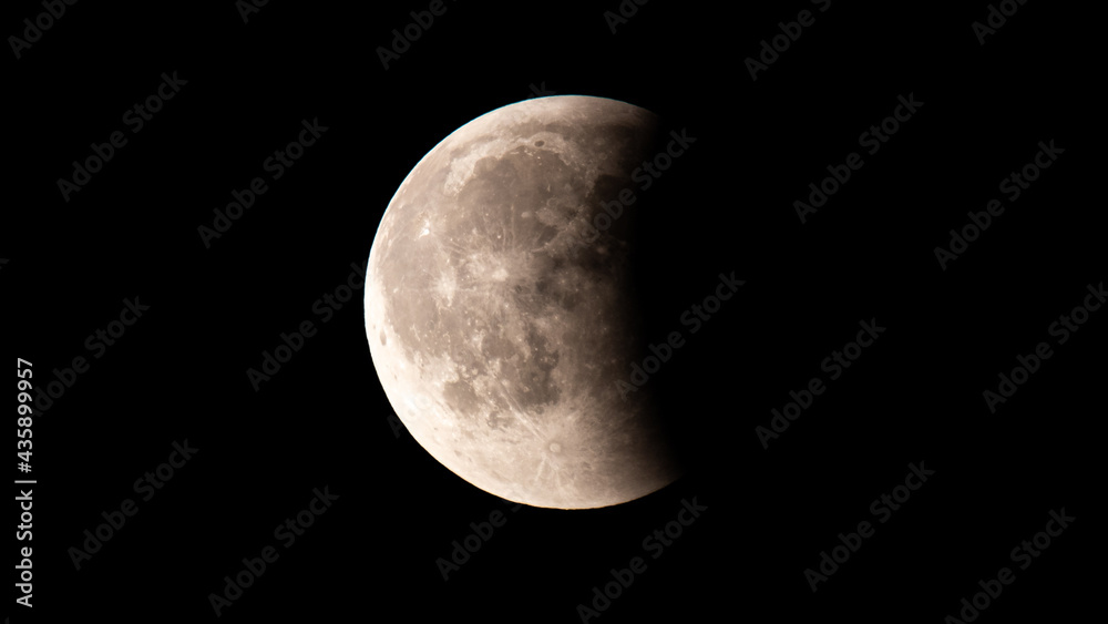 Stuttgart, Germany, 27.07.2018. Lunar eclipse over Stuttgart at the end of the red blood moon phase Stuttgart, Germany, 27.07.2018. Lunar eclipse over Stuttgart at the end of the red blood moon phase