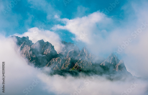Clouds over mountain peaks in the Dolomites  Italy.