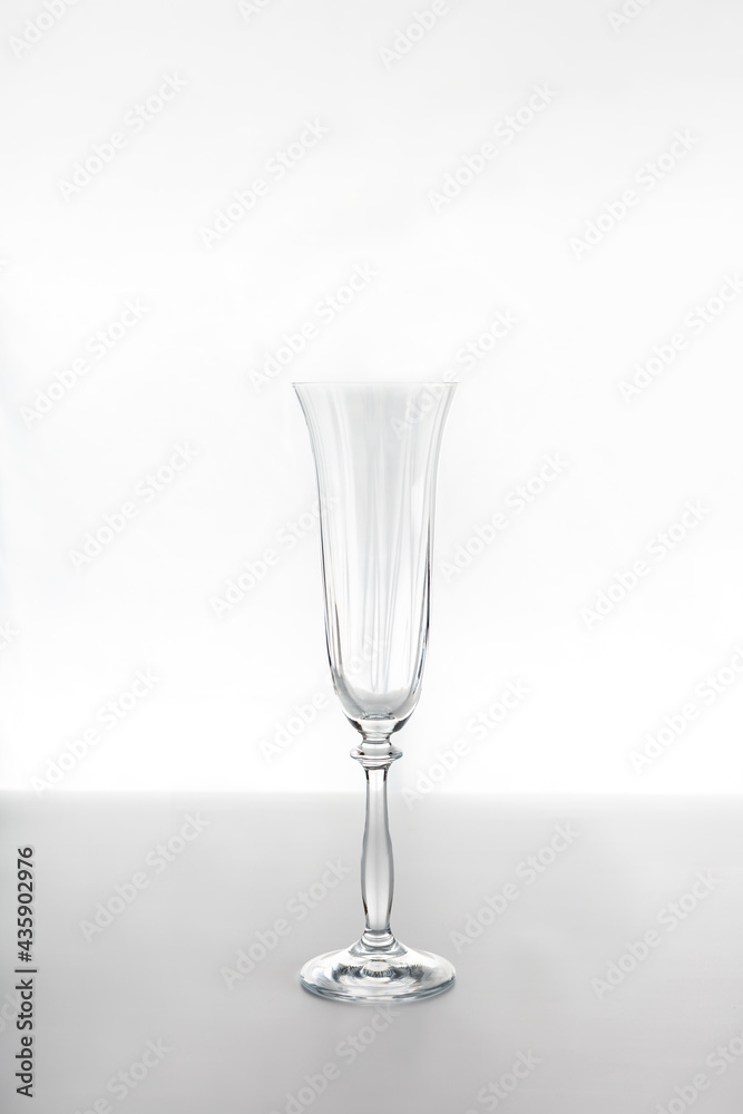 Obraz premium Empty glass flute glass on a white background