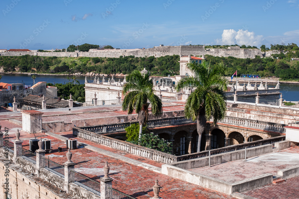 view of the harbor and old Havana and the flag of Cuba from the rooftop