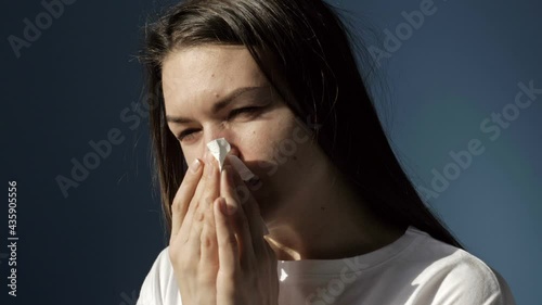 Portrait of a sick woman with symptoms of flu, cold or coronavirus.