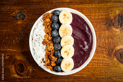 Blueberry smoothie bowl with granola and fresh fruit