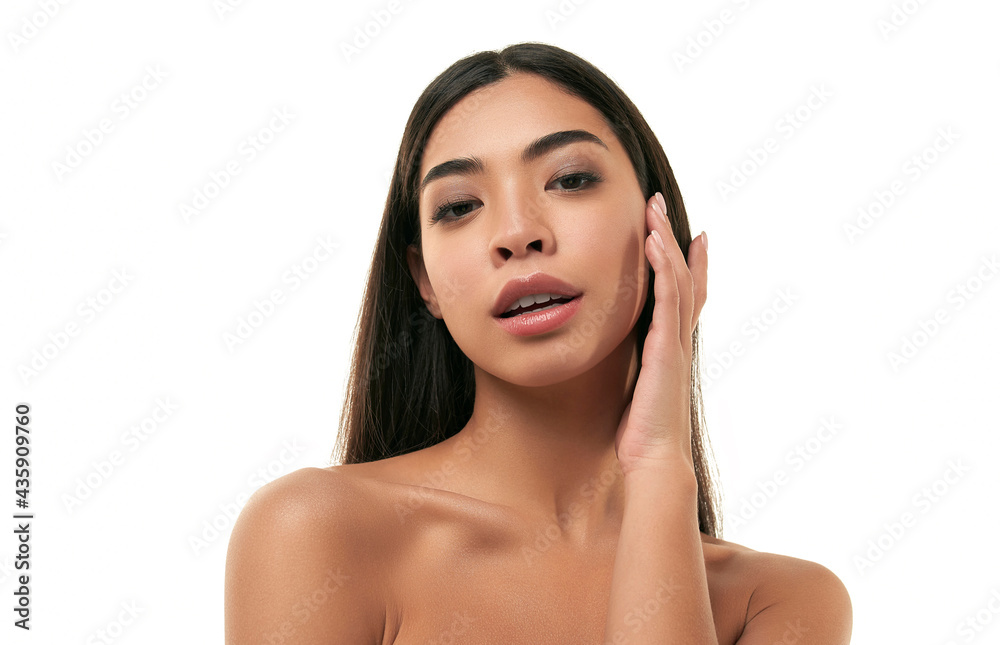 Young Asian woman with clean radiant healthy skin isolated on white background. Facial skin care concept, cosmetology, spa. Young Asian woman with clean radiant healthy skin isolated on white background. Facial skin care concept, cosmetology, spa.