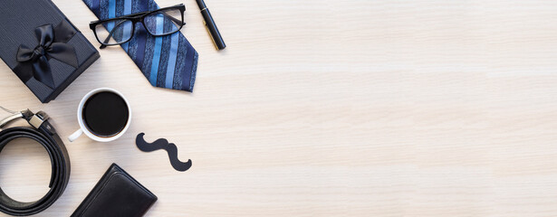Design concept top view of Father's day gift idea with greeting on wood background.