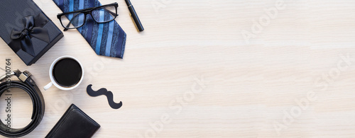 Design concept top view of Father's day gift idea with greeting on wood background.