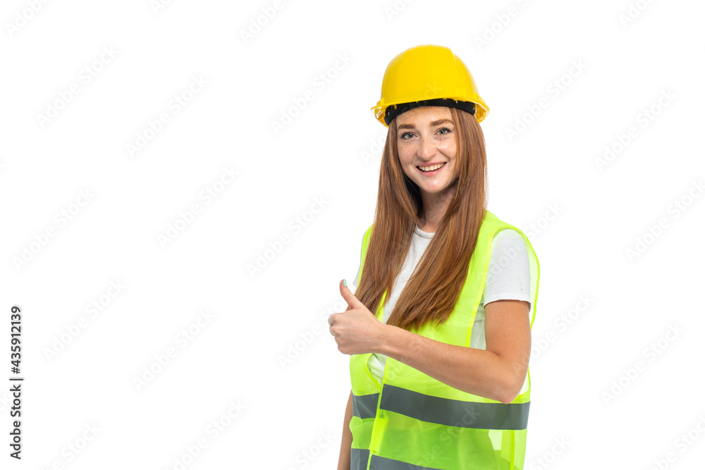 Young beautiful woman with red hair in helmet at studio