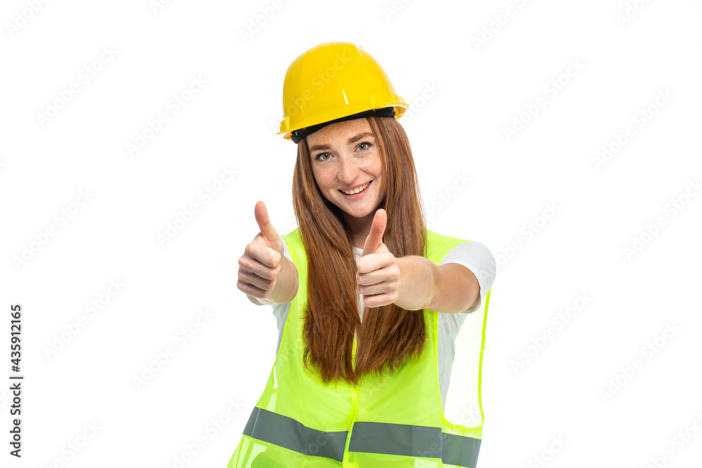 Young beautiful woman with red hair in helmet at studio Young beautiful woman with red hair in helmet at studio