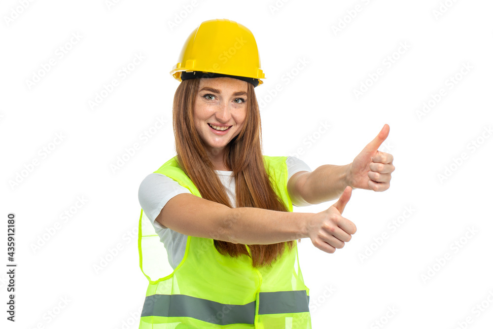 Young beautiful woman with red hair in helmet at studio Young beautiful woman with red hair in helmet at studio