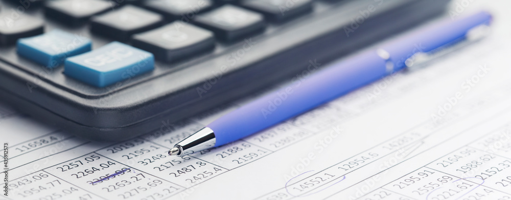 Accounting document with pen, money, coins and checking financial chart. Concept of banking, financial report and financial audit. Accounting document with pen, money, coins and checking financial chart. Concept of banking, financial report and financial audit.