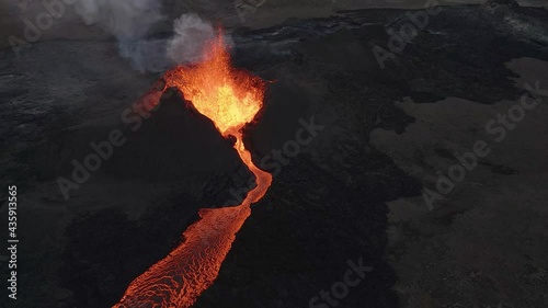 Aerial drone circling around volcano erupting near Fagradalsfjall in Iceland photo