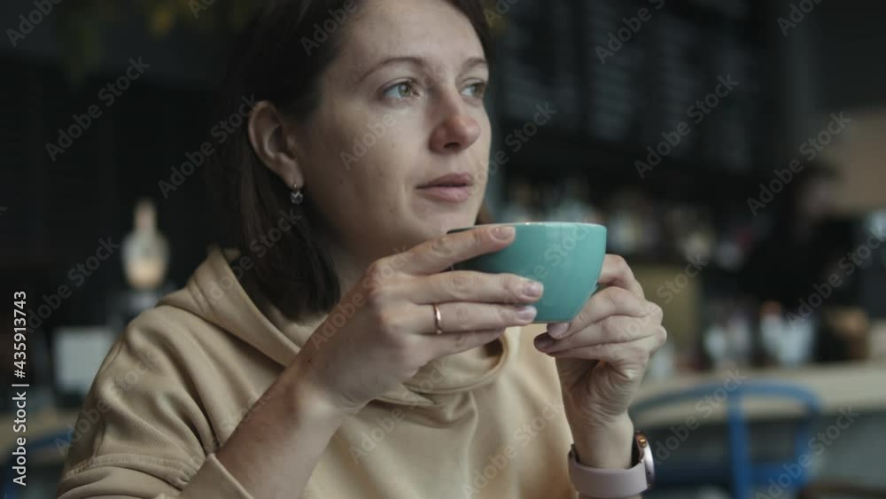Portrait of relaxed young woman drink coffee in coffee shop Portrait of relaxed young woman drink coffee in coffee shop