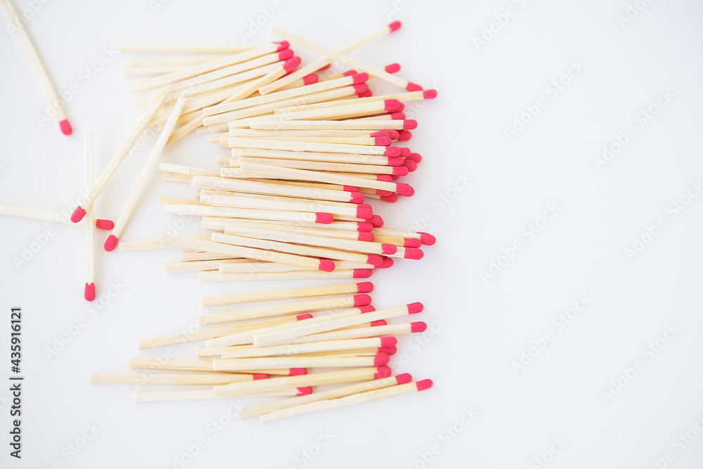 Long matches with a red head on a white background. Long matches with a red head on a white background.