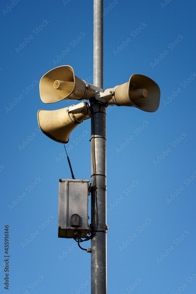 Three trumpeters on a pole with an antenna. Three trumpeters on a pole with an antenna.
