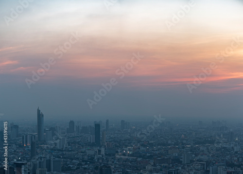 Bangkok city skyline at melacholic lonely misty sunset view from Baiyok ii Tower