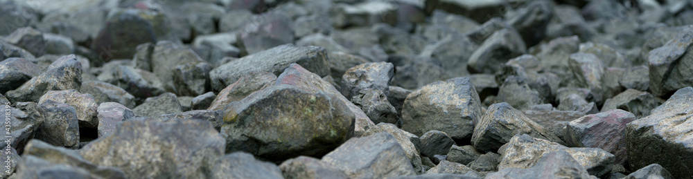 large stones on the bank by the river large stones on the bank by the river