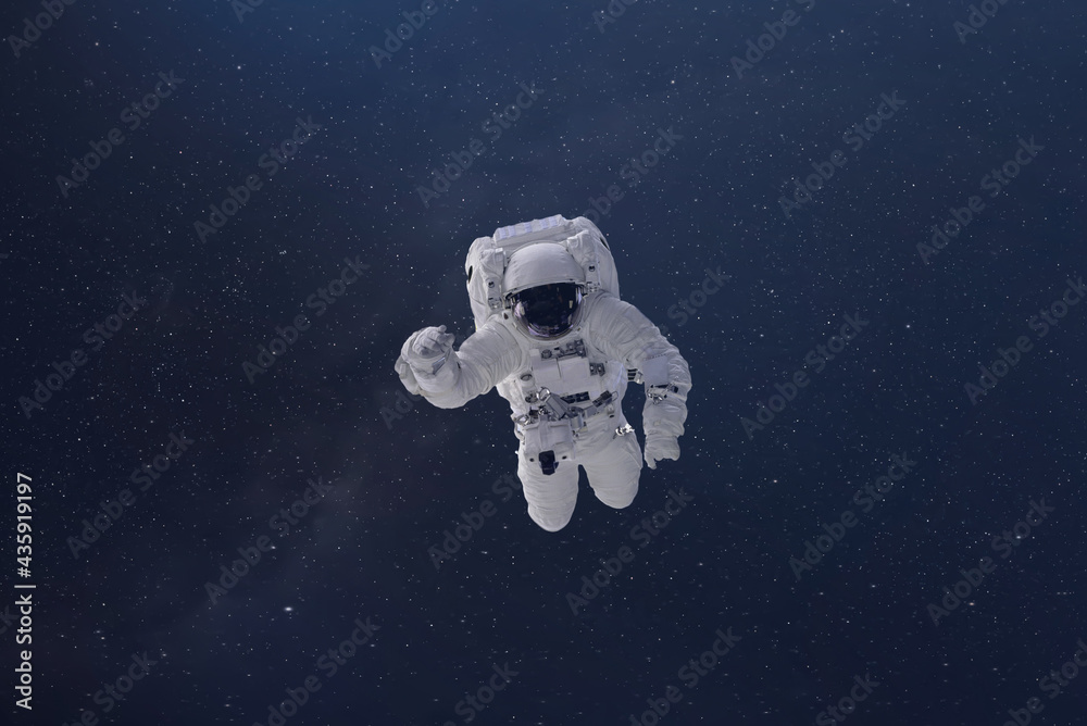 cosmonaut fly in the outer space with stars and galaxy background with a light beam. elements of this image furnished by nasa cosmonaut fly in the outer space with stars and galaxy background with a light beam. elements of this image furnished by nasa
