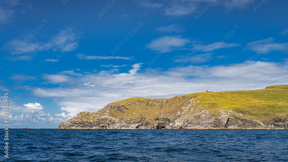 Bray Head coastline seen from Kerry Cliffs and blue waters of Atlantic Ocean on a summer day, Portmagee, Iveragh Peninsula, Ring of Kerry, Ireland