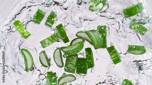 Super slow motion of splashing aloe vera slices into water. Filmed on high speed cinema camera at 1000 fps