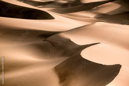 Patterns and waves of Sand Dunes with ripples seen from Death Valley National Park, California  photo