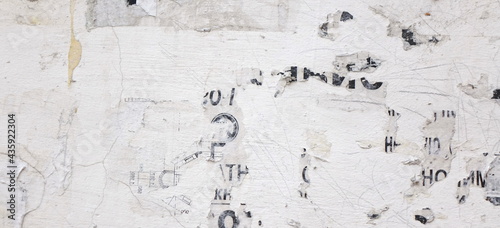 Crumpled Creased Paper and Torn Posters Wide Texture or Background. Urban Old Wall with Scratched Advertising Panoramic Background. Old Urban Street Billboard With Torn Posters And Stickers