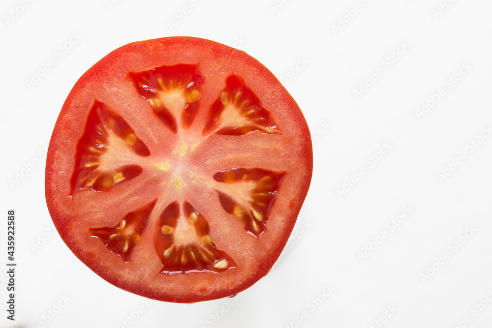 juicy red tomato slice isolated close up of seeds flesh and textures juicy red tomato slice isolated close up of seeds flesh and textures