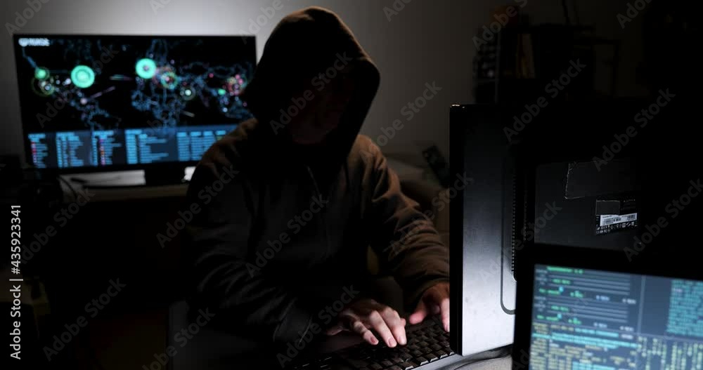 Computer hacker types code attempting to hack a computer server Stock ...