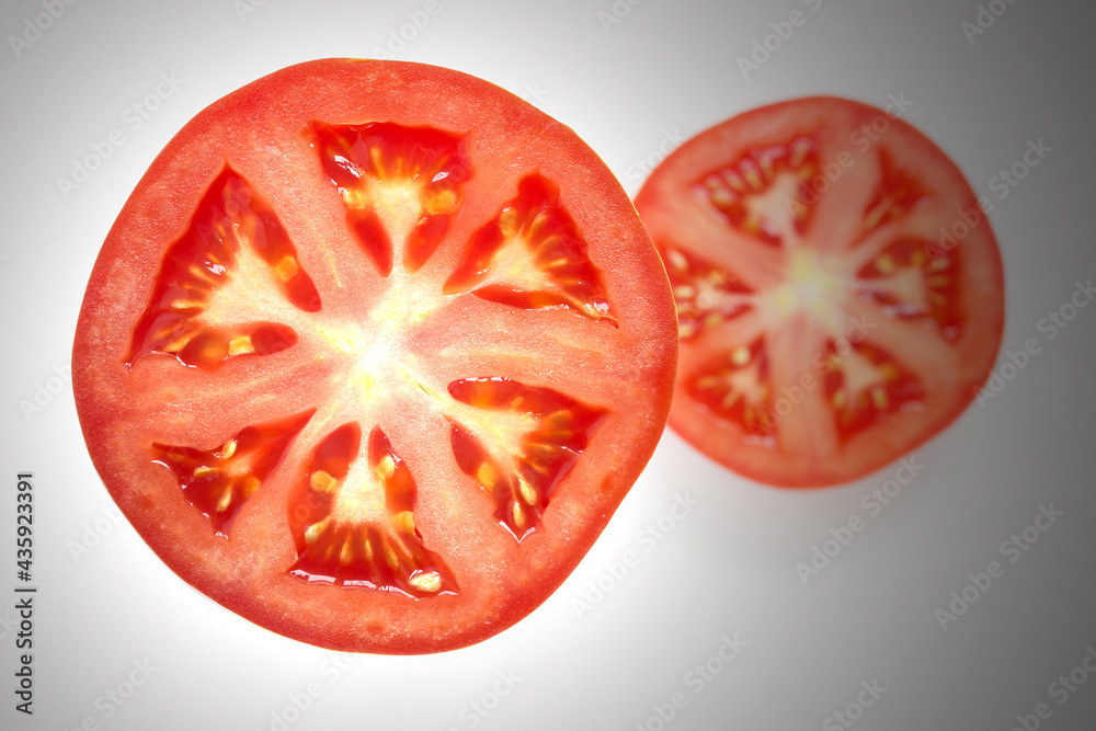 juicy red tomato slice isolated close up of seeds flesh and textures juicy red tomato slice isolated close up of seeds flesh and textures
