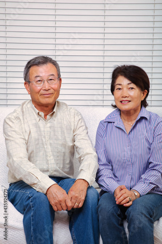 Japanese senior couple smiling at the camera