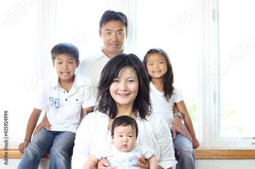 Japanese family smiling at the camera