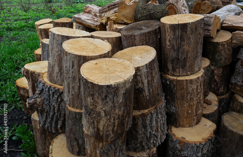 Pile of chopped firewood, natural wood background. Firewood for the winter