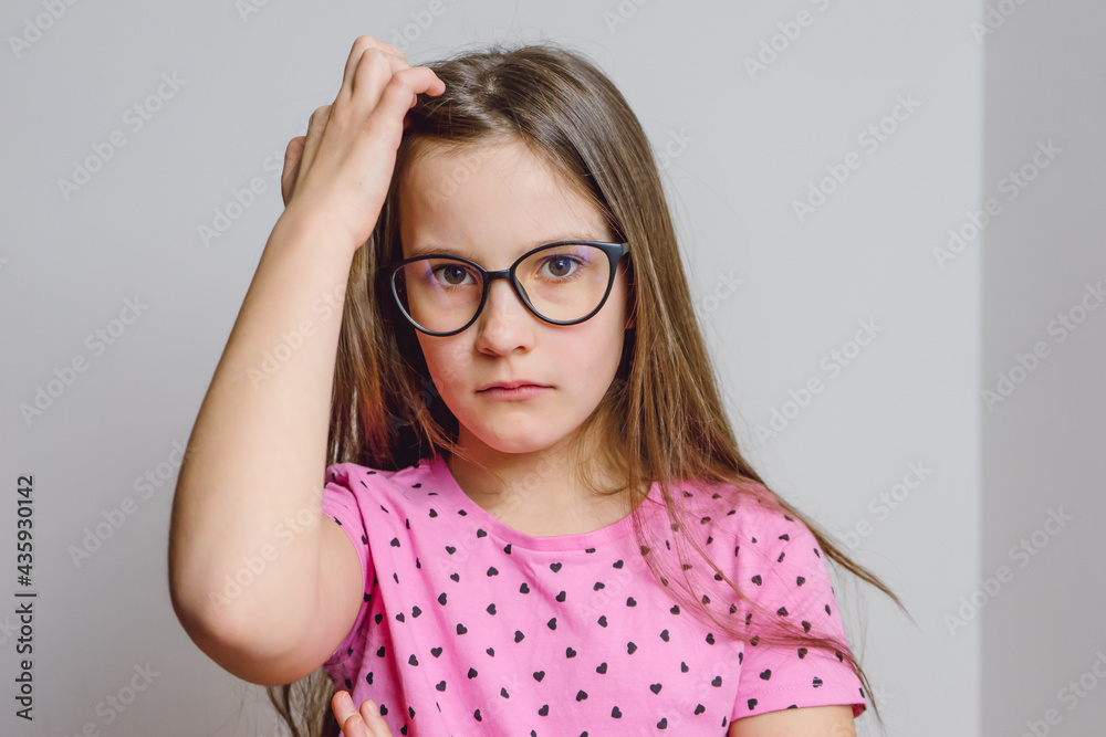 Portrait of a cute beautiful 8 year old girl with glasses Portrait of a cute beautiful 8 year old girl with glasses