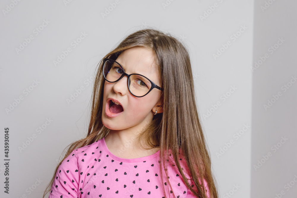 Portrait of a cute beautiful 8 year old girl with glasses Portrait of a cute beautiful 8 year old girl with glasses