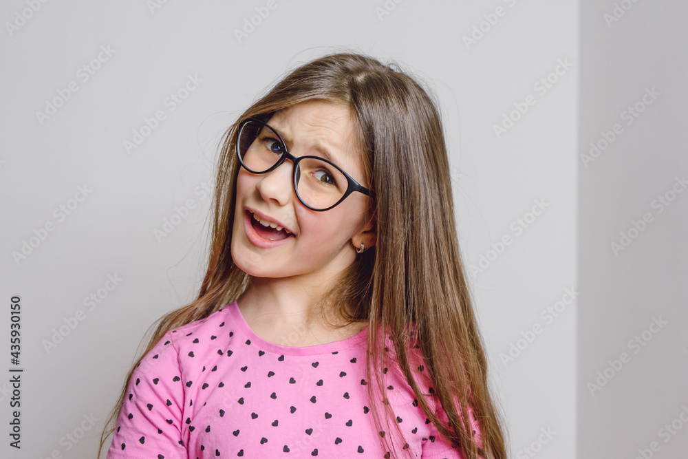 Portrait of a cute beautiful 8 year old girl with glasses Portrait of a cute beautiful 8 year old girl with glasses