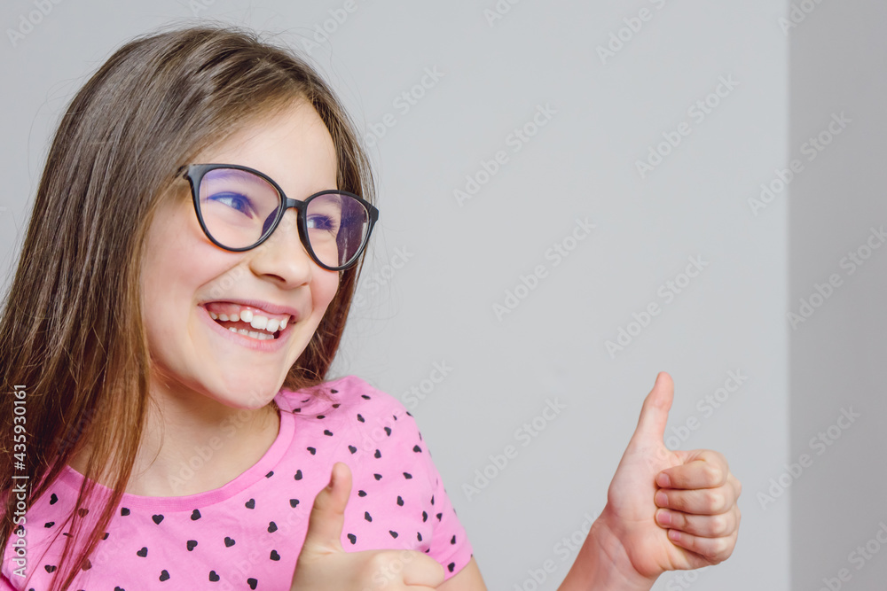 Portrait of a cute beautiful 8 year old girl with glasses Portrait of a cute beautiful 8 year old girl with glasses