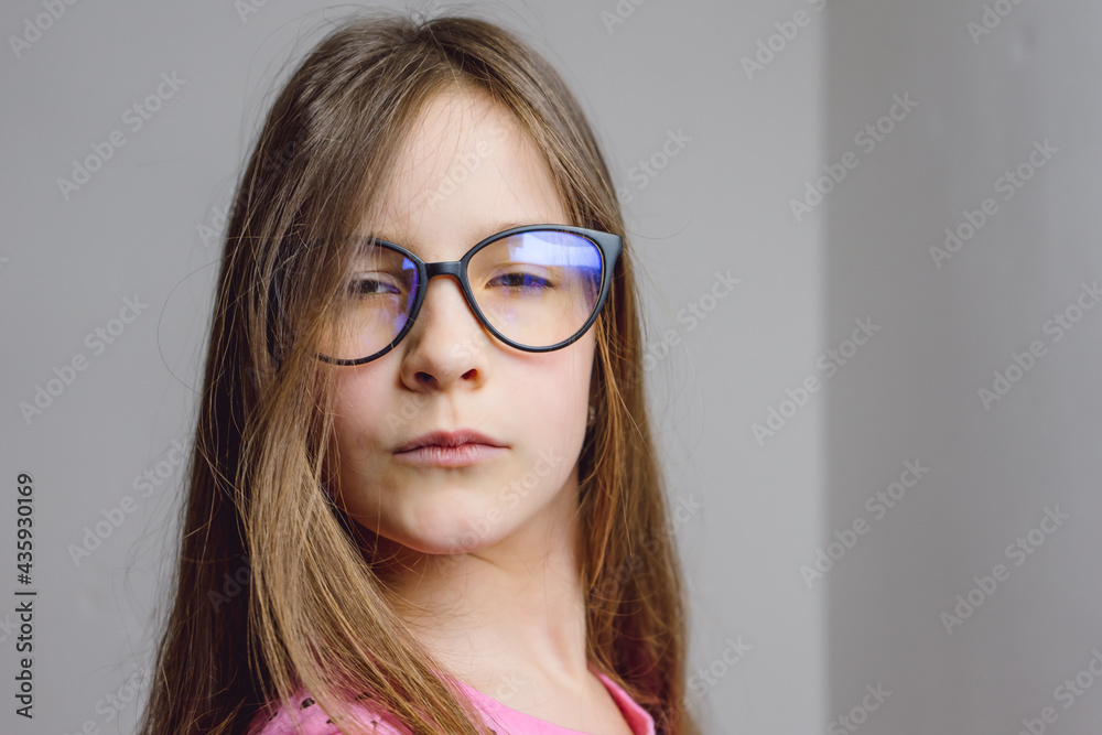 Portrait of a cute beautiful 8 year old girl with glasses Portrait of a cute beautiful 8 year old girl with glasses