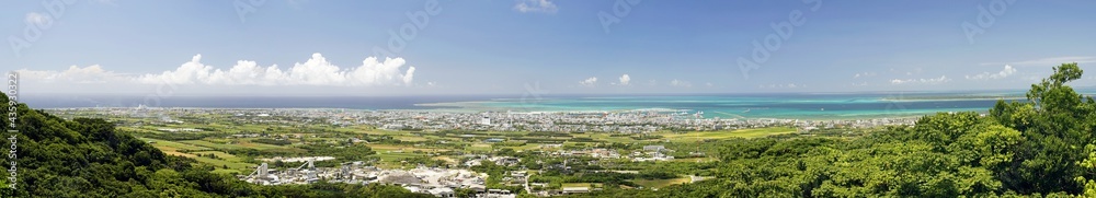 Okinawa,Japan - May 24, 2021: Panoramic view of Ishigaki City and Ishigaki port, Okinawa, Japan, from Banna park
