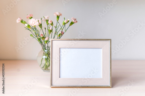 Fototapeta Naklejka Na Ścianę i Meble -  Portrait white with gold picture frame mockup and jewelry box