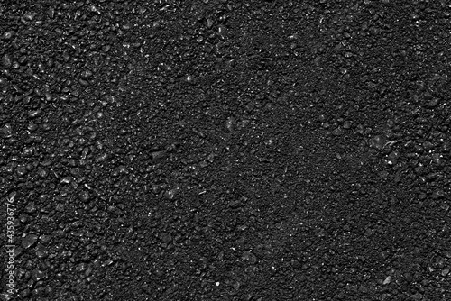 Fototapeta Naklejka Na Ścianę i Meble -  Asphalt pavement with a beautiful black texture  lit by a soft light. Japanese style.