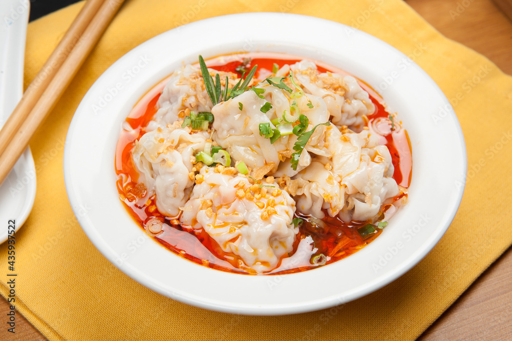 Dim sum dumplings in soup at a Korean restaurant. Dim sum dumplings in soup at a Korean restaurant.
