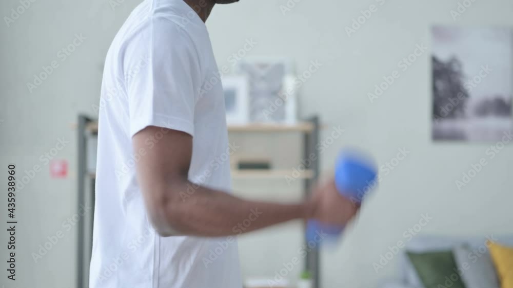 Close up of Athletic African Man Working out with Dumbbells Close up of Athletic African Man Working out with Dumbbells